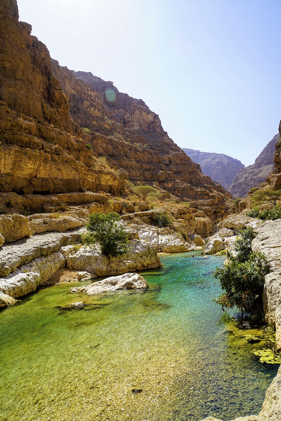 A turquoise-green natural pool in a rocky canyon in Egypt